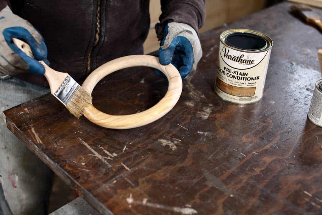 applying pre-stain on wood