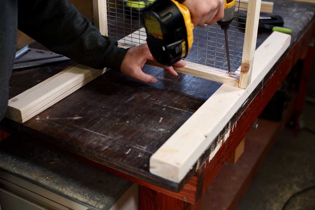 attaching legs to floor frame of DIY rabbit hutch