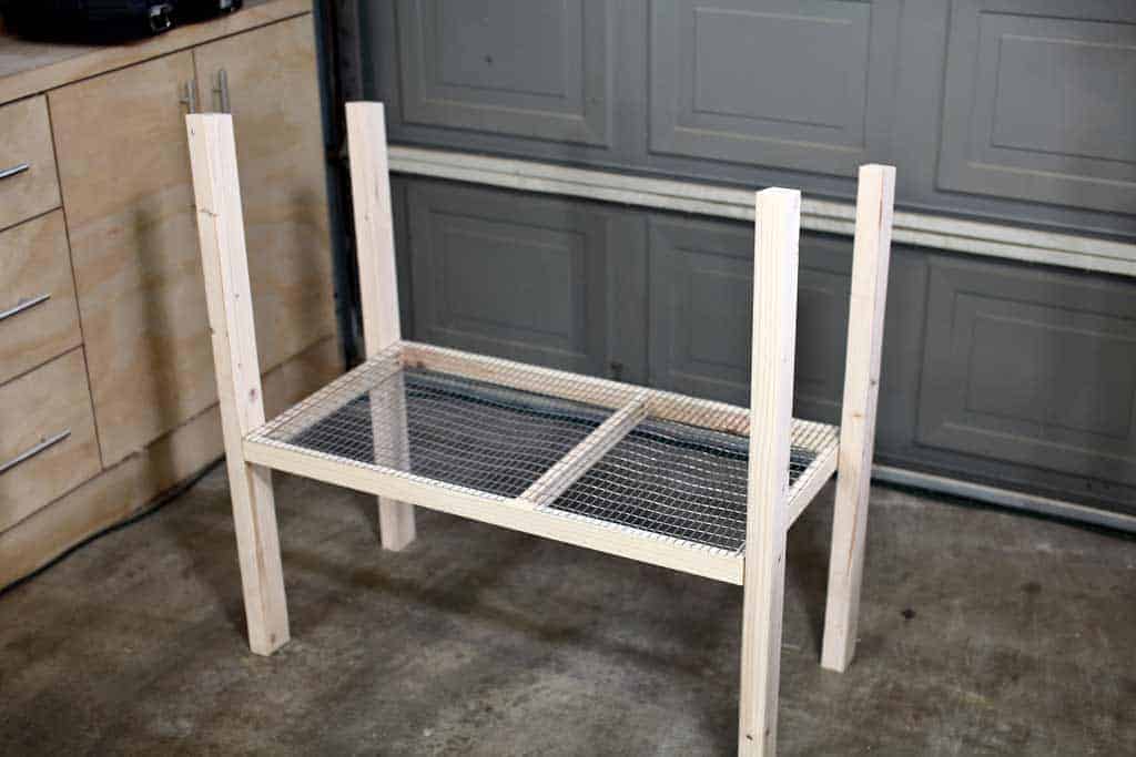 attaching floor to legs of the DIY rabbit hutch