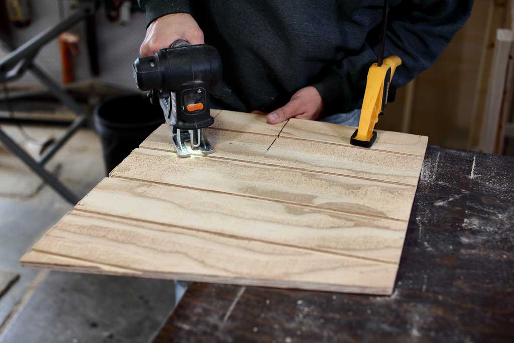 using jig saw to cut out opening in middle divider