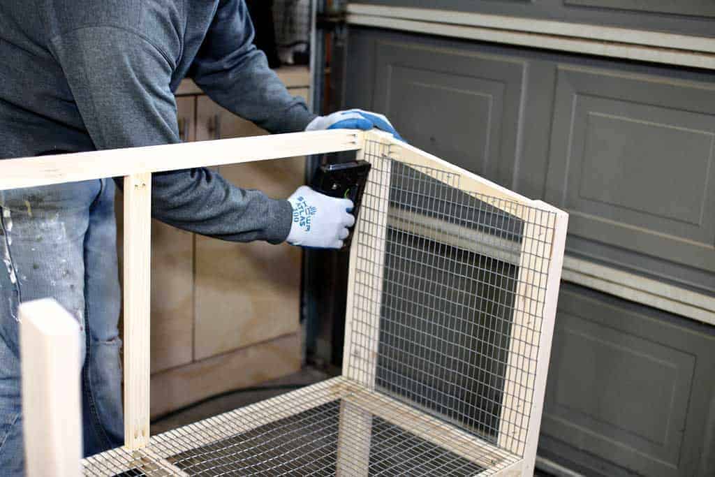 stapling wire mesh screen to DIY rabbit hutch
