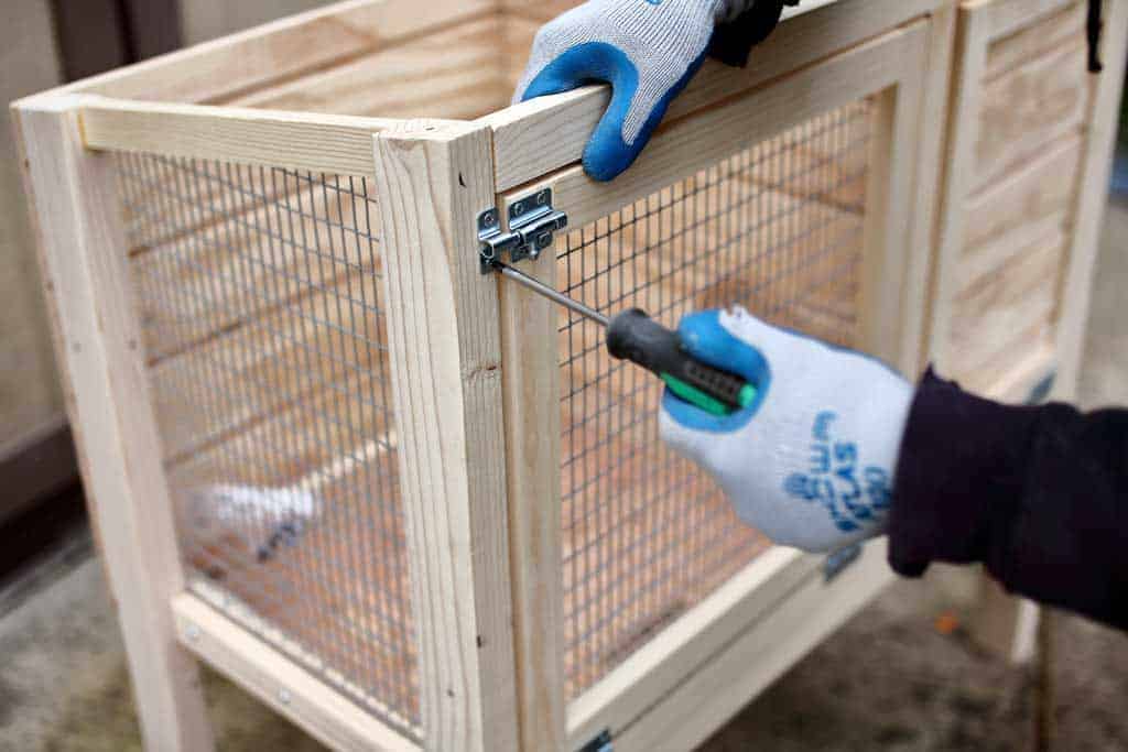 attaching door locks to the DIY rabbit hutch