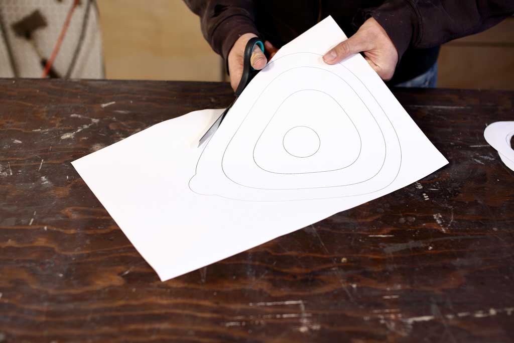 cutting birdhouse shapes with scissors