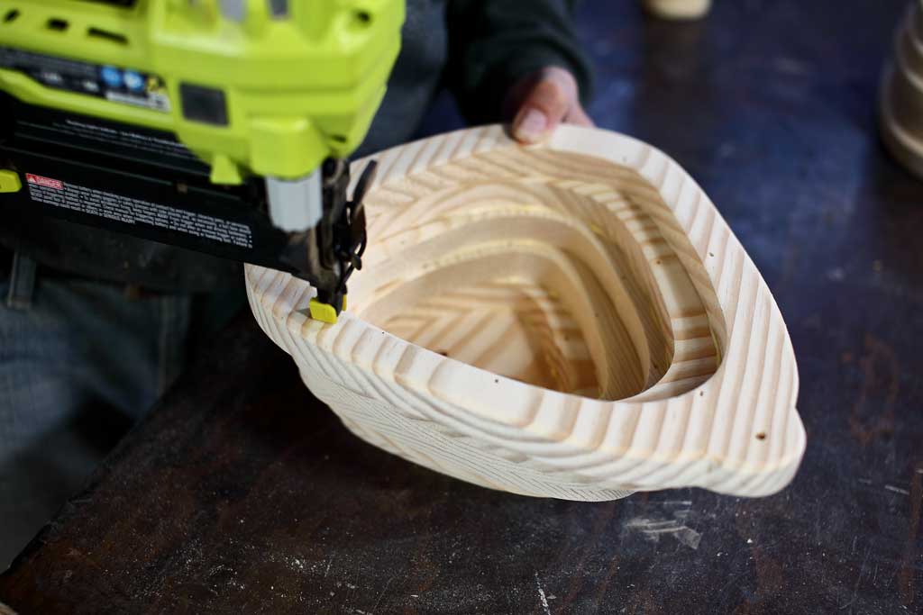 nailing pieces to the birdhouse