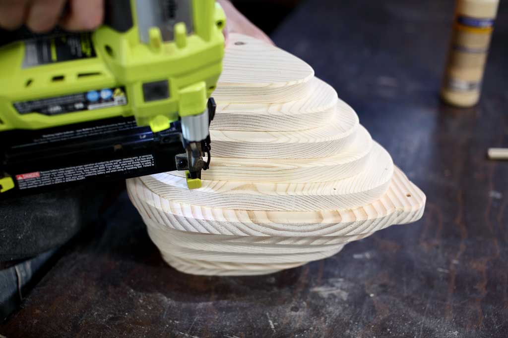 using nail gun to attach boards for the birdhouse