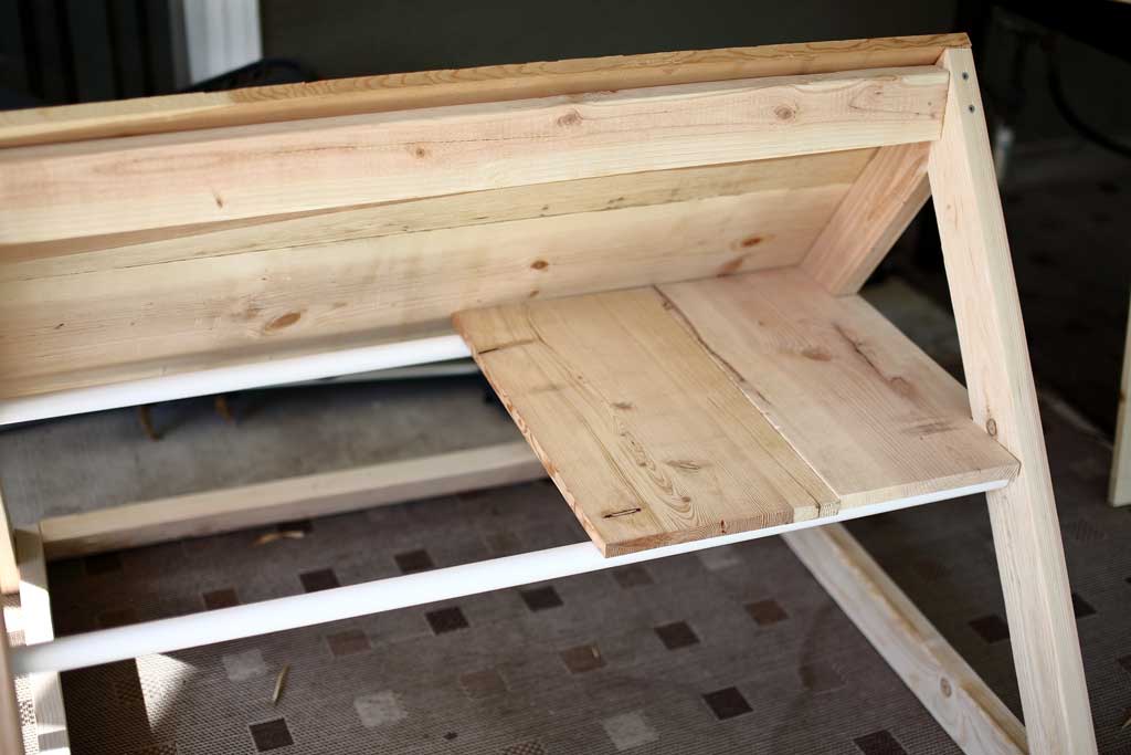 installing floor boards inside the chicken coop