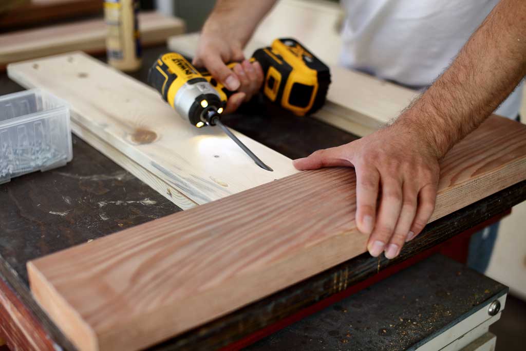 attaching rails to backrest of sofa