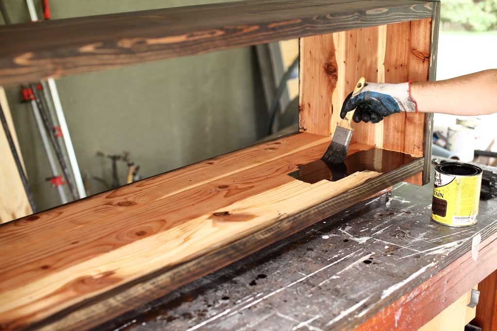 applying stain on bench wood