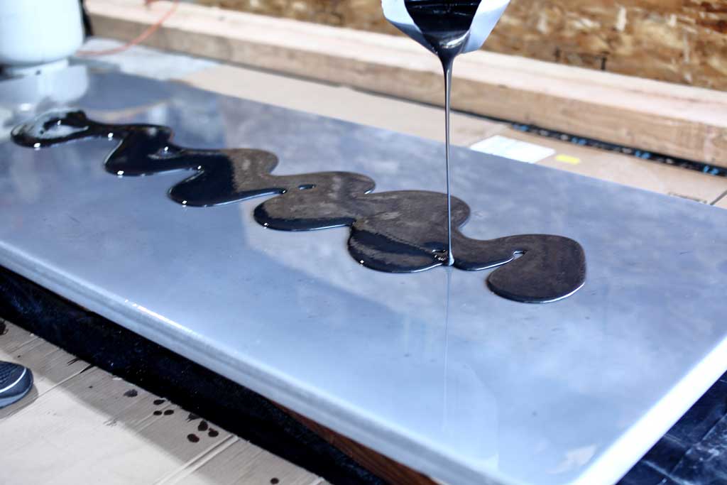 pouring epoxy on tabletop